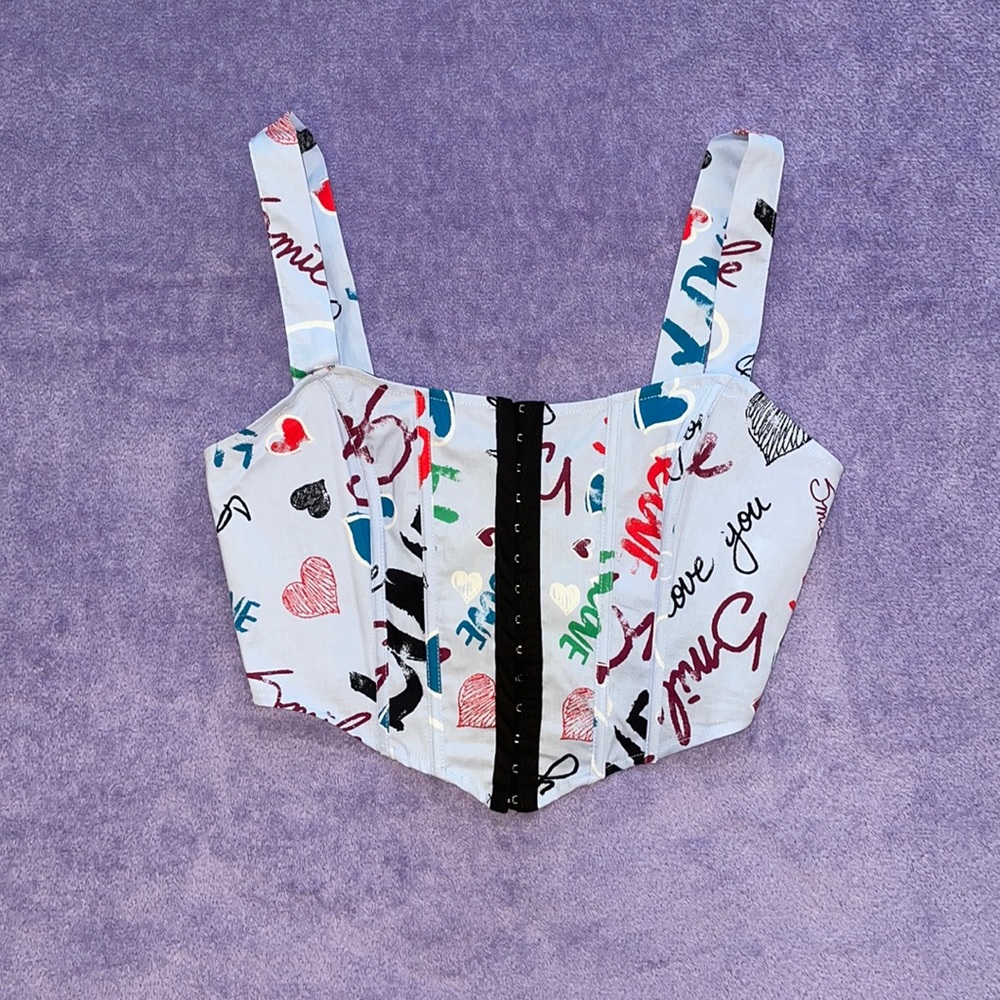 Rabbit Rose graffiti corset crop top with black center line down the middle💙